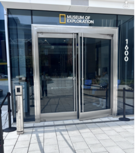 View of street-level, double doors with push-button assist