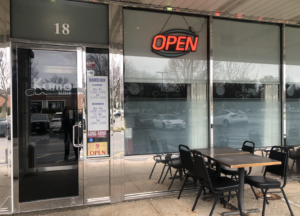 Street-level, single door entrance to Kumo