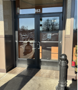Street-level, double door entrance to Caffe Amici