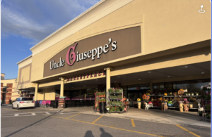 Street-level, automatic doors to Uncle Guiseppe's